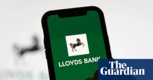 Lloyds Banking Group sign outside a branch as the bank expands its AI hiring drive
