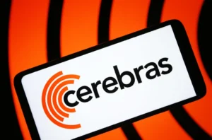 Smartphone displaying the Cerebras logo against an orange background with black curved lines.
