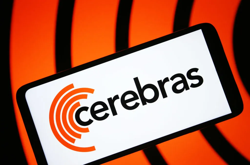 Smartphone displaying the Cerebras logo against an orange background with black curved lines.