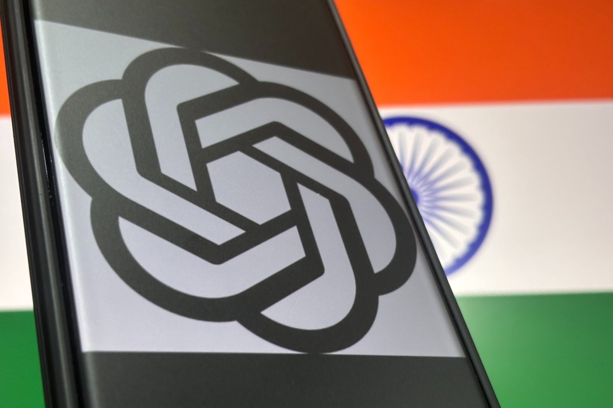 OpenAI logo on a smartphone screen with the Indian flag in the background.