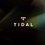 TIDAL logo on a dark, abstract background with subtle rainbow light reflections.