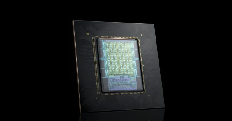 Close-up of a computer chip with intricate circuitry on a black background.