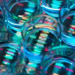 Close-up of transparent petri dishes with colorful reflections and patterns, creating an abstract, vibrant effect.