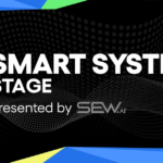Smart Systems Stage banner with blue lightbulb icon and text "Presented by SEW.ai" on a black dotted background.