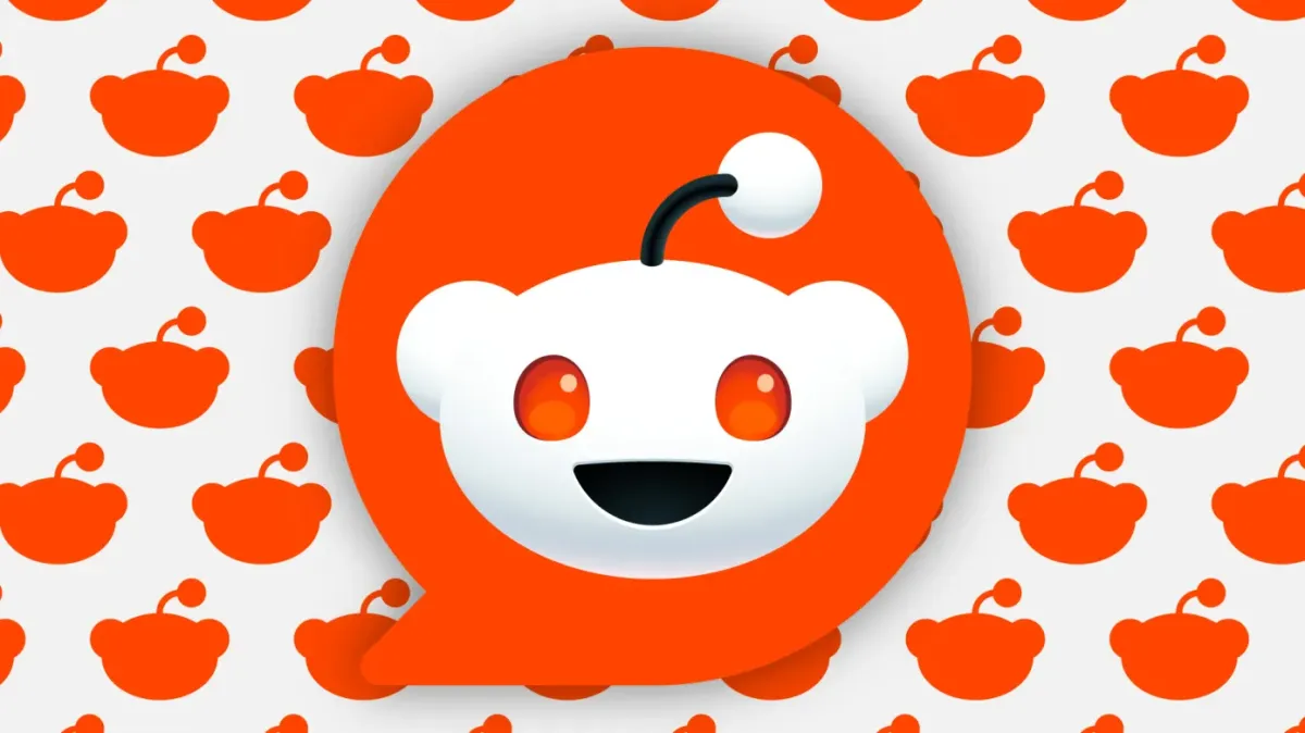 Reddit logo with orange background and repeating pattern of the logo in the background.