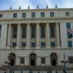 AI standards office leadership change highlighted by a government building exterior