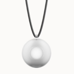 A round, white wearable device on a black cord, centered on a plain white background.