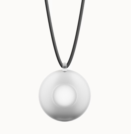 A round, white wearable device on a black cord, centered on a plain white background.