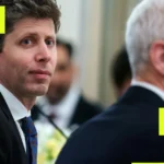 Two people in suits seated in a formal setting, one looking at the camera, with abstract yellow square overlays.