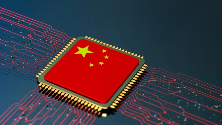 Computer chip with Chinese flag design, surrounded by red circuitry on a dark background.