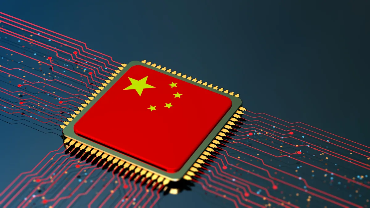 Computer chip with Chinese flag design, surrounded by red circuitry on a dark background.