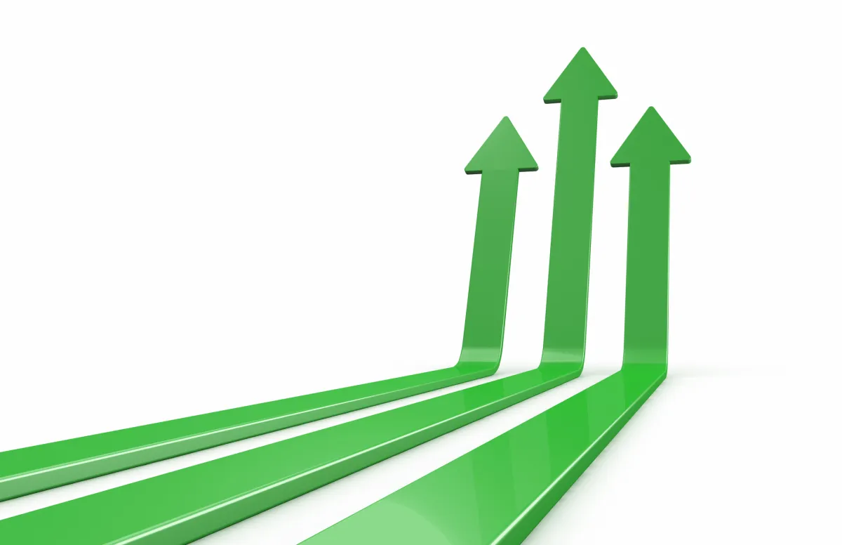 Three green upward arrows on a white background, symbolizing growth and progress.