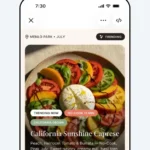 Smartphone screen displaying a recipe for California Sunshine Caprese with colorful tomatoes and burrata, labeled trending.