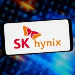 SK Hynix logo on a smartphone screen, with binary code in the blue and orange background.