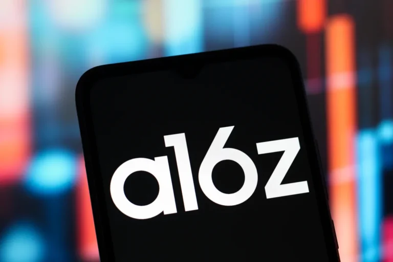 Smartphone screen displaying "a16z" logo, blurred colorful background.