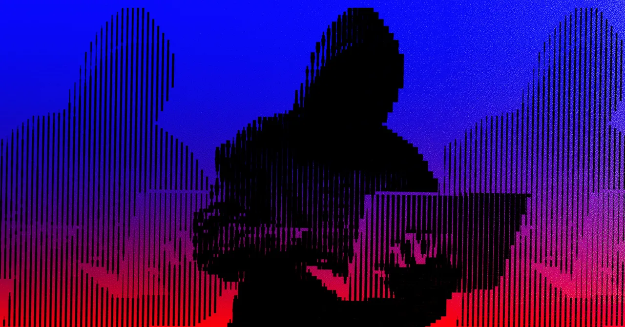 Silhouetted figure in a hoodie using a laptop against a striped blue and red background.