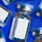 Multiple vaccine vials with blank labels on a blue background.
