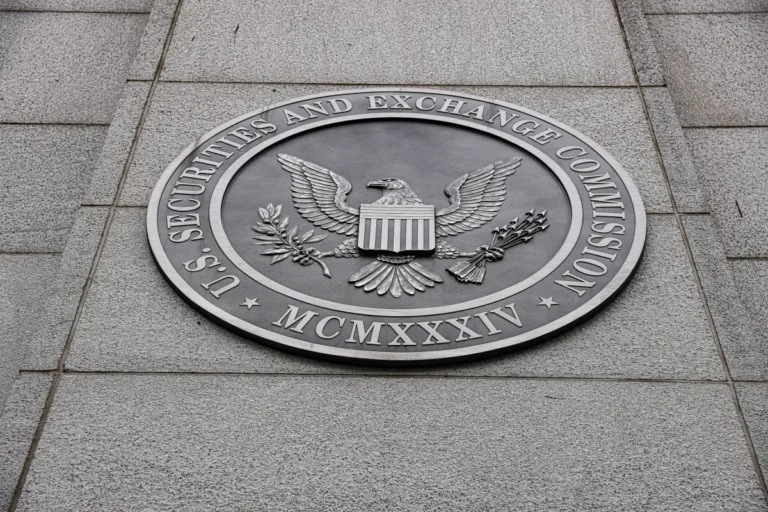 U.S. Securities and Exchange Commission seal on a stone wall, featuring an eagle with shield and inscriptions.