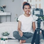 Creator working on AI influencers content on a laptop during new disclosure rules
