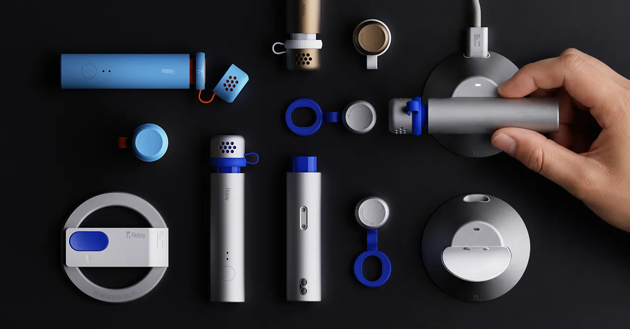 Various Relay-branded devices, including cylinders and discs, displayed on a black surface. A hand holds one device.