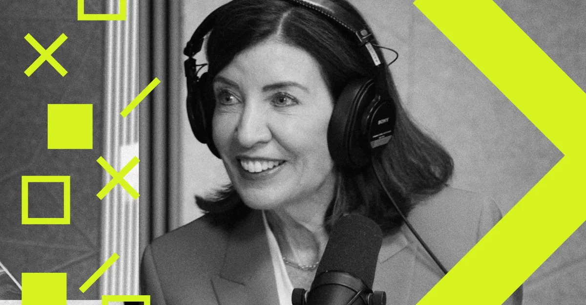 Woman in headphones speaking into a microphone, geometric yellow shapes overlayed, grayscale image.