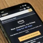 Amazon order emails on a phone screen with vague category labels and AI shopping context