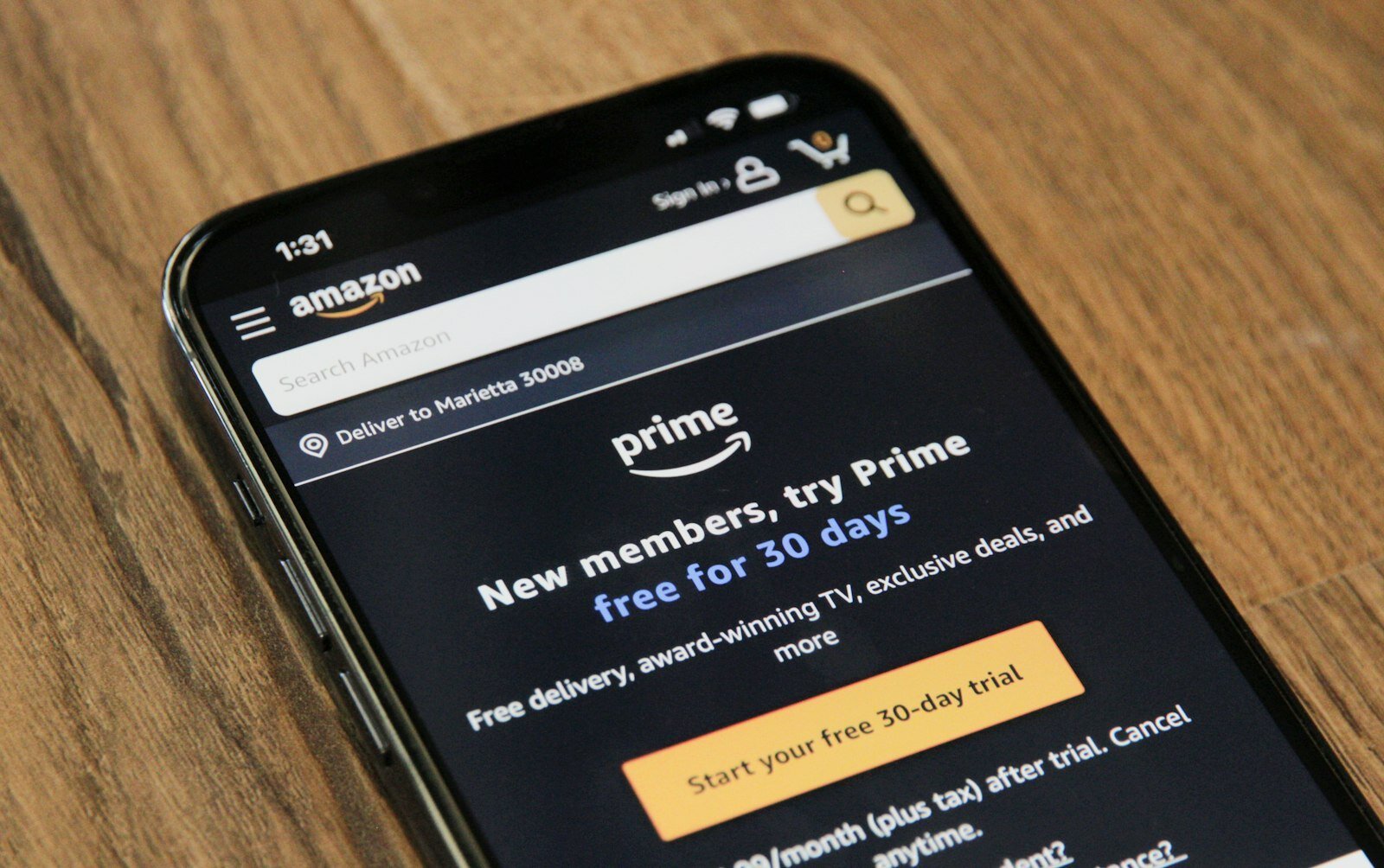 Amazon order emails on a phone screen with vague category labels and AI shopping context