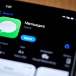 Close-up of an iPhone screen displaying the Apple Messages app in the App Store with the option to open it.