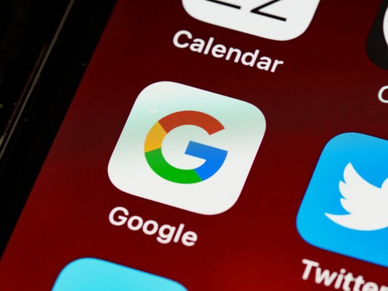 Gemini app milestone on a smartphone screen with Google branding and voice assistant interface