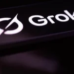 Grok logo in white text on a dark background with a stylized circular design to the left.