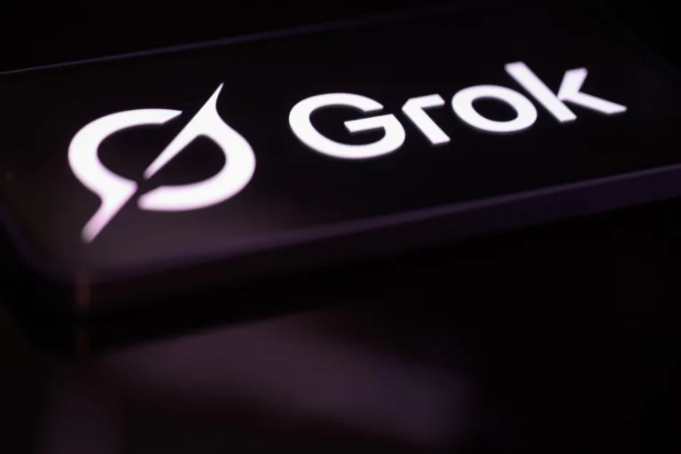 Grok logo in white text on a dark background with a stylized circular design to the left.