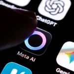 Finger touching Meta AI app icon on a smartphone screen, with other app icons visible including ChatGPT and Copilot.