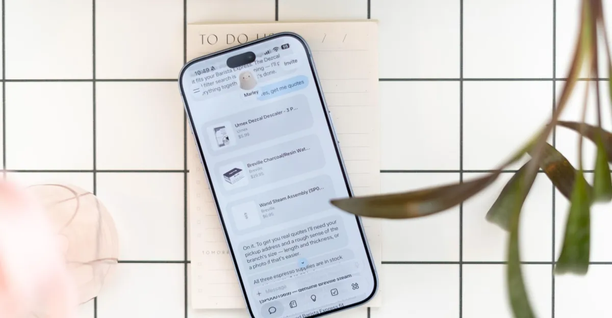 Smartphone displaying shopping list app on a grid-patterned surface with a to-do list and plant leaves nearby.