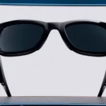 Black sunglasses with dark lenses on a white background, displayed on a blue-bordered platform.