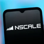 Smartphone screen displaying Nscale logo with stylized graphic, set against a blurred blue and orange background.
