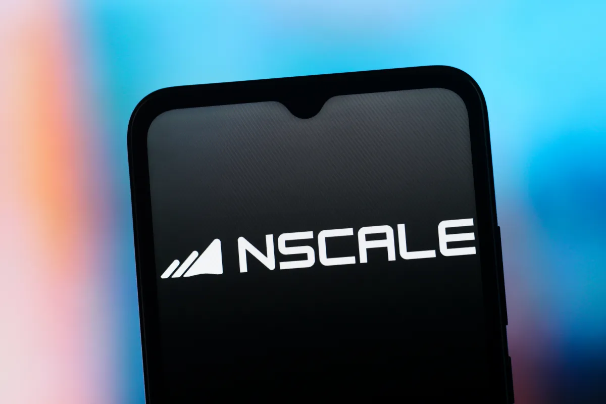 Smartphone screen displaying Nscale logo with stylized graphic, set against a blurred blue and orange background.