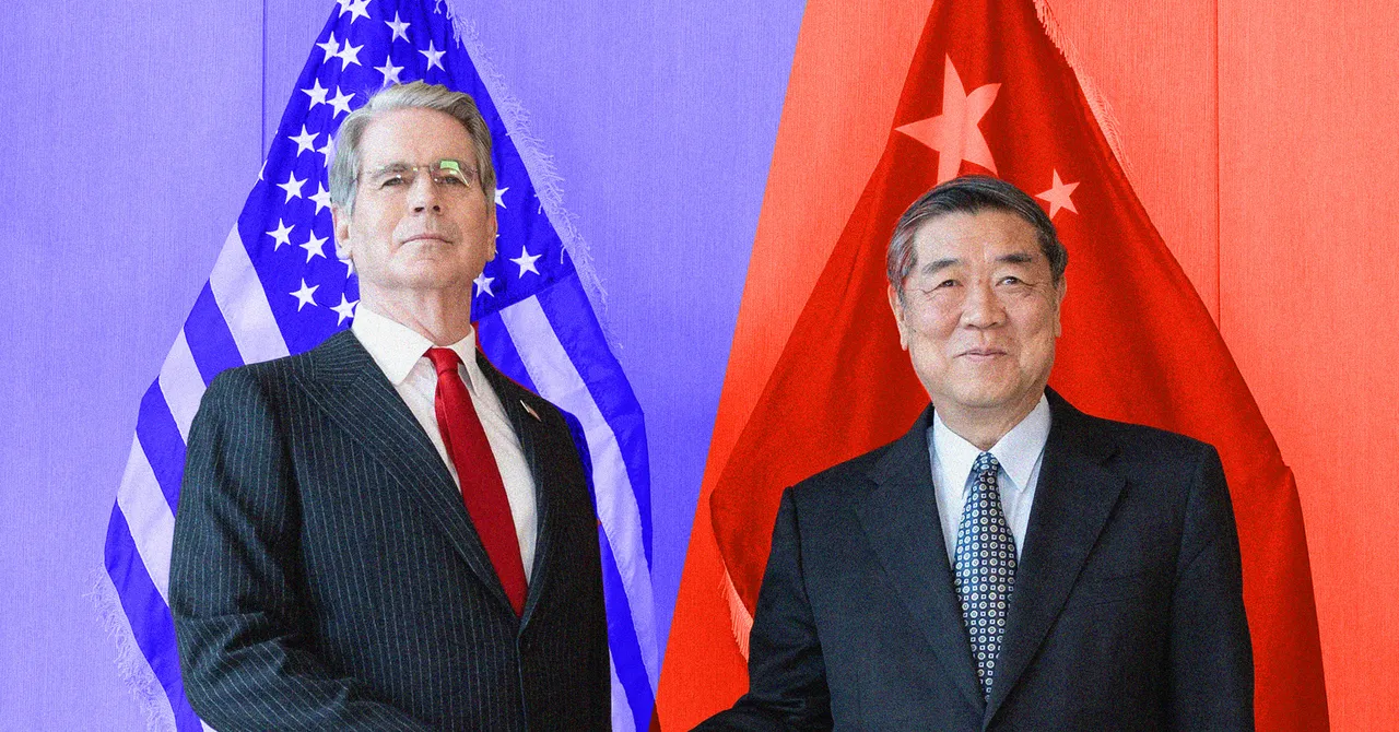 Two men in suits stand in front of U.S. and Chinese flags, posing for a photo.