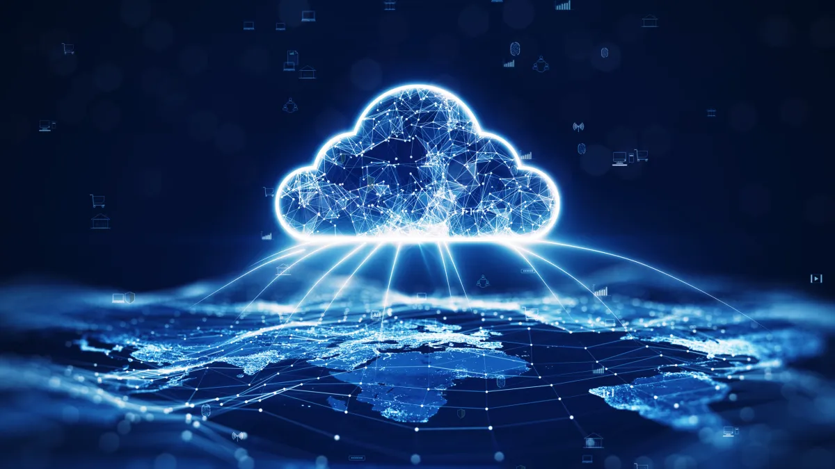 Glowing digital cloud network over a world map, with interconnected nodes and data icons on a dark blue background.