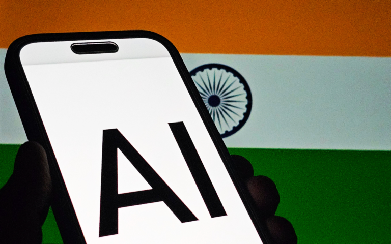 Smartphone screen displaying "AI" against the backdrop of the Indian flag