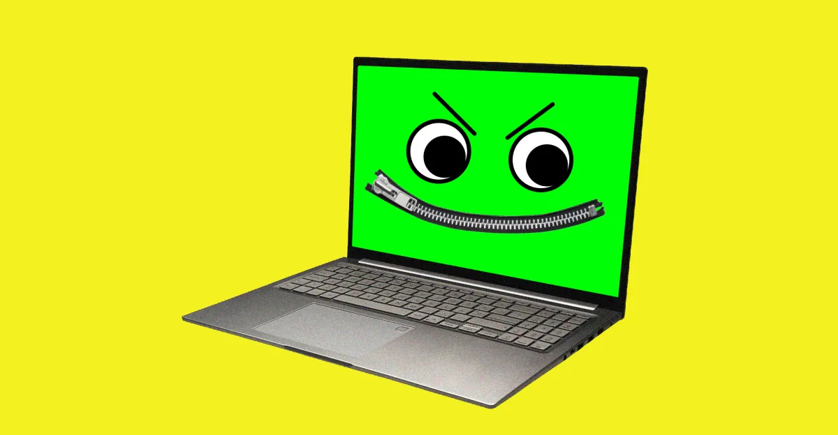 Laptop with a green screen displaying a cartoon face with large eyes and a zipper mouth on a yellow background.