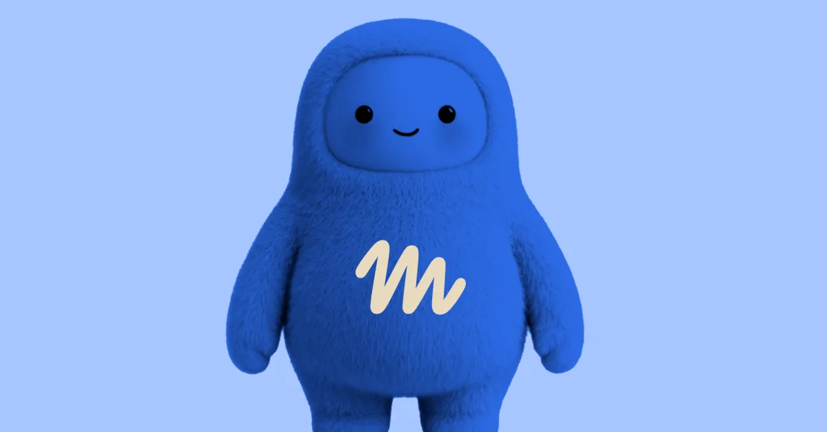 Blue, furry humanoid character with a smiling face and "m" logo on chest, set against a light blue background