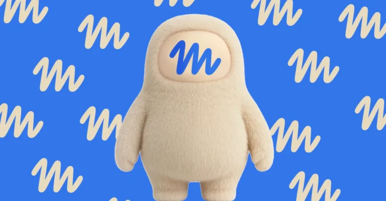 Fuzzy beige character with a blue "M" face on a blue background with repeating "M" patterns.
