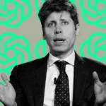 Man in a suit gesturing, speaking, with a microphone on his lapel, against a background of overlapping teal logos.