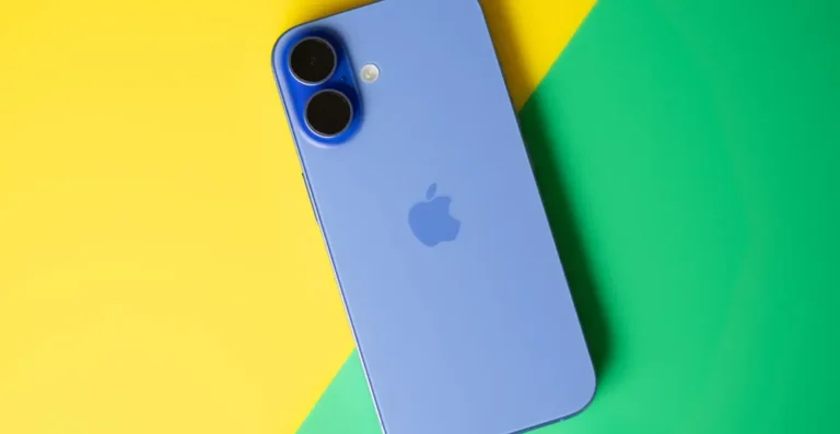 Blue iPhone with dual cameras on a yellow and green background.