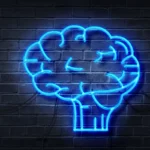 Blue neon brain sign on a dark brick wall background.