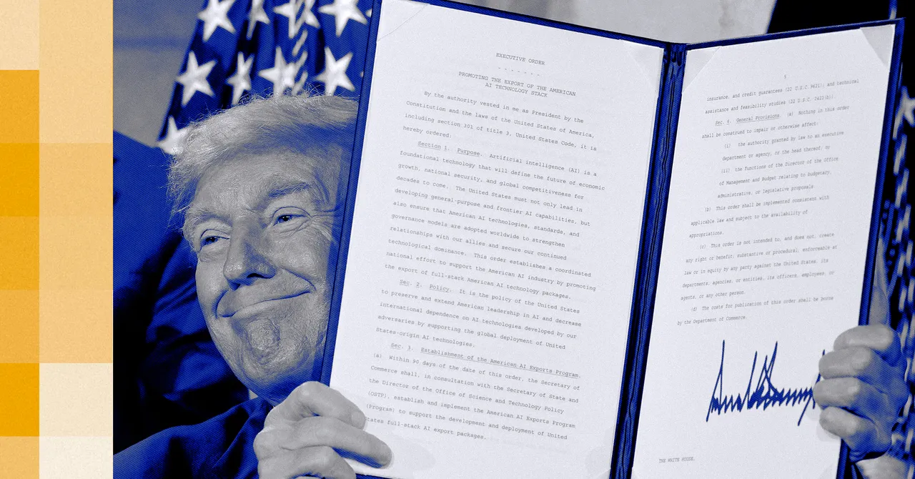 Man in blue suit holding up a signed executive order document with visible text, U.S. flag in the background.