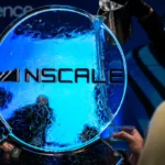 Nscale logo on an ice sculpture, blue lighting, person holding a cup, another pouring liquid from a pitcher.