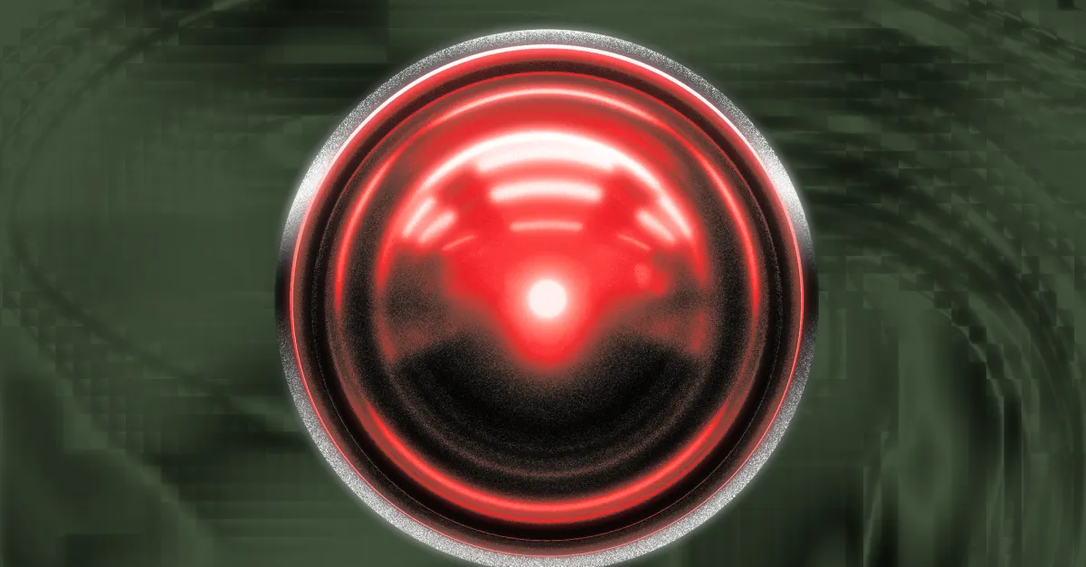 Red glowing lens resembling a camera or eye on a dark, blurred background.