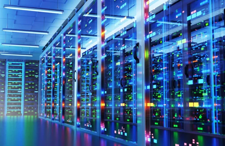 Rows of illuminated server racks in a data center with colorful LED lights reflecting on glass doors