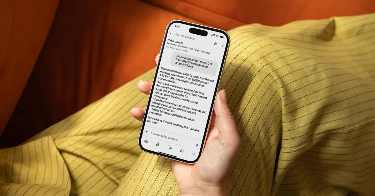 Hand holding a smartphone displaying a message from Alexa for shopping, verifying an OTP text from Amazon.